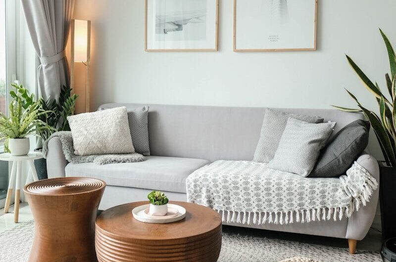a living room filled with furniture and a large window